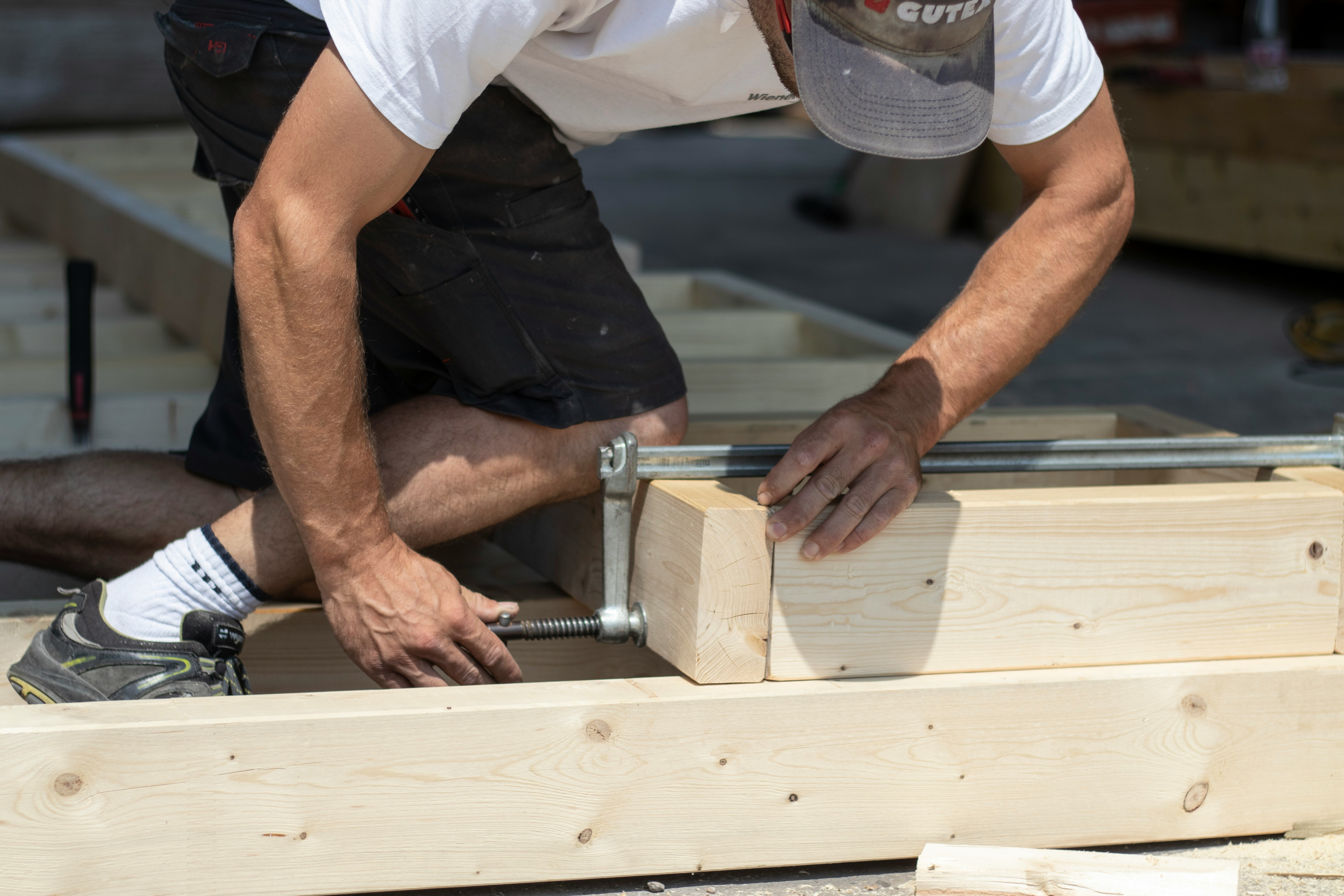 Image of a worker meticulously patching a roof